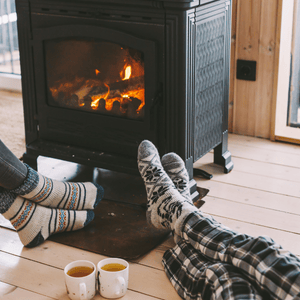 cozy sock feet fire place and tea
